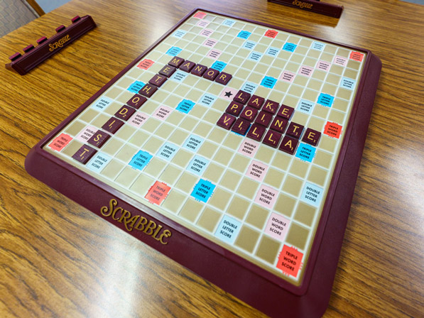 A scrabble game with the words "Methodist", "Manor", "Lake", "Pointe", and "Villa".